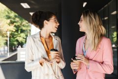 two-beautiful-young-businesswomen-walking-outdoors